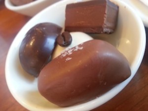 Almond Cafe (center), Dark Chocolate Truffle (left), Mocha (top), Milk Chocolate Butterscotch (bottom)